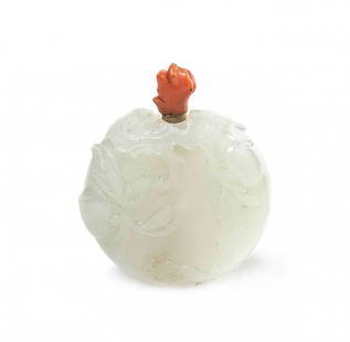 A Carved White Jade Snuff Bottle, Height 3 1/4 inches.: A Carved White Jade Snuff Bottle, of an even, white stone, of compressed peach form, having relief carving depicting a peach-laden leafy tree with gnarled branches above a bat, with a coral stopper kn