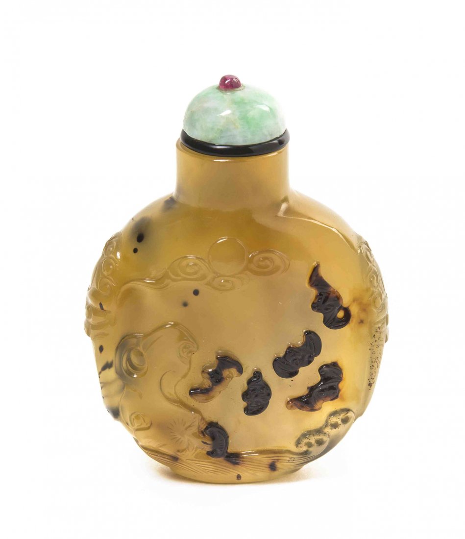 A Suzhou Carved Shadow Agate Snuff Bottle, Height 2 1/4: A Suzhou Carved Shadow Agate Snuff Bottle, of compressed rounded form, carved beast mask handles issuing faux rings, one side with bats carved from the inclusions, above swirling waves and below scrol