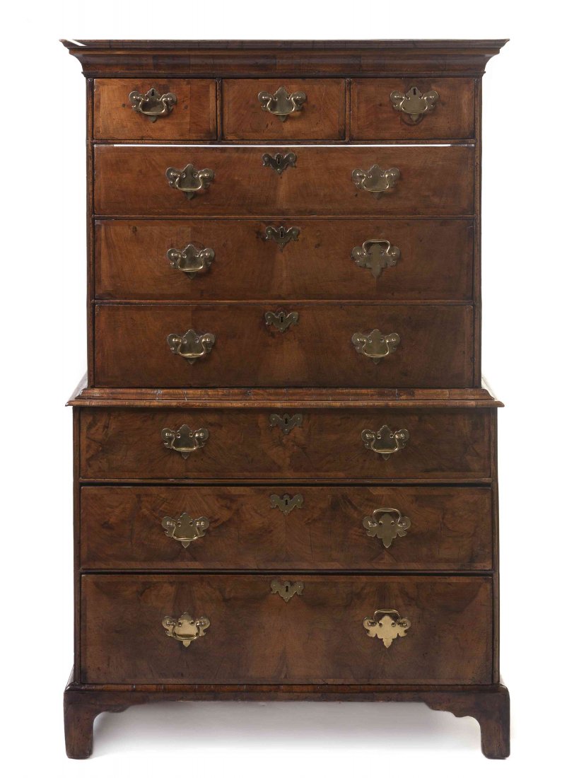 A George II Walnut Chest on Chest, Height 63 1/2 x: A George II Walnut Chest on Chest, in two parts, the superstructure having three short drawers over three false drawers opening to a later compartment, the base set with three graduated long drawers r