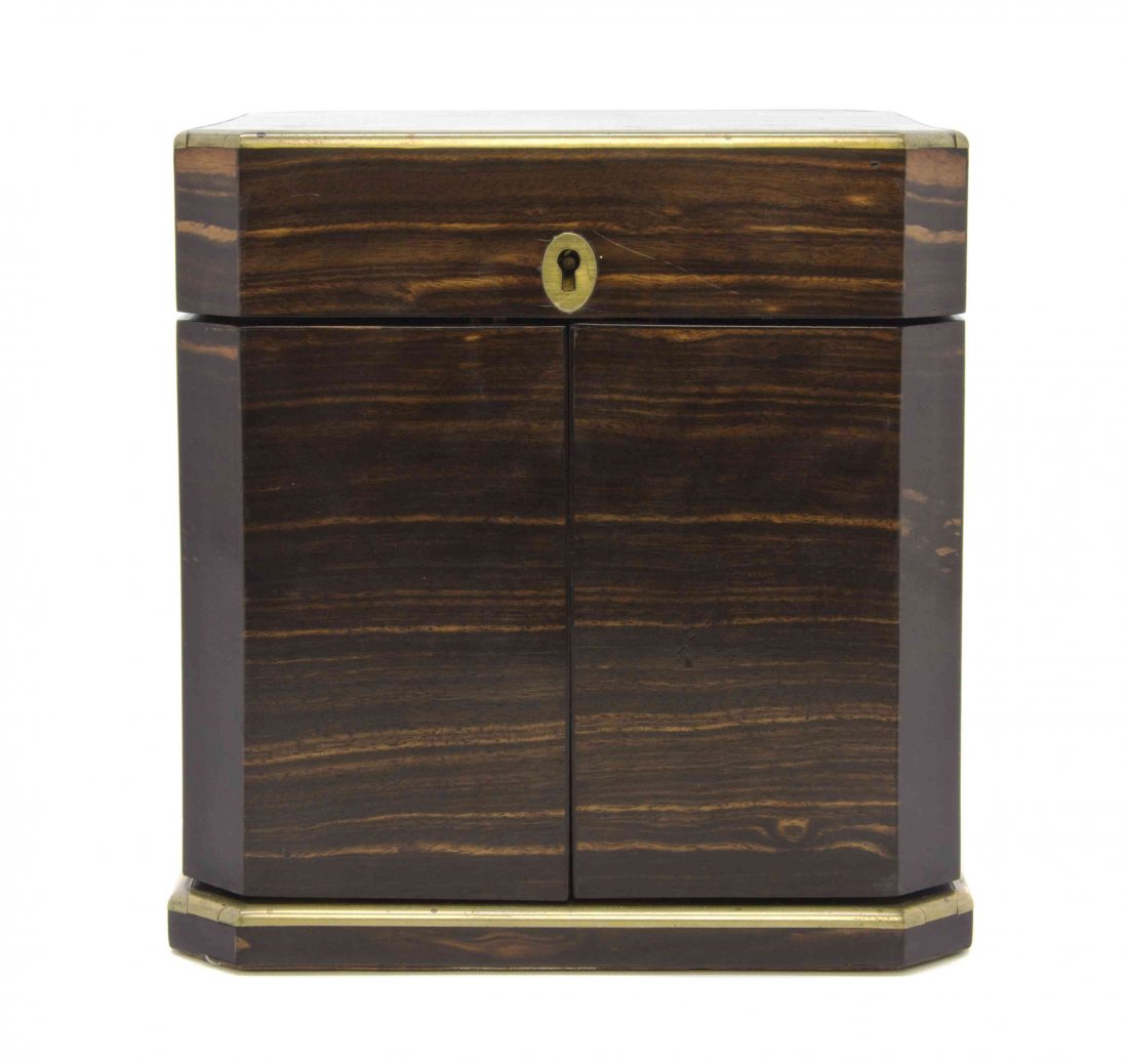 A Late Victorian Brass Banded Rosewood Liquor Chest,: A Late Victorian Brass Banded Rosewood Liquor Chest, having a hinged top and sides opening to four cut glass bottles with silver caps, London 1892, bearing a maker's mark of MC. Width 6 3/4 inches. Pr