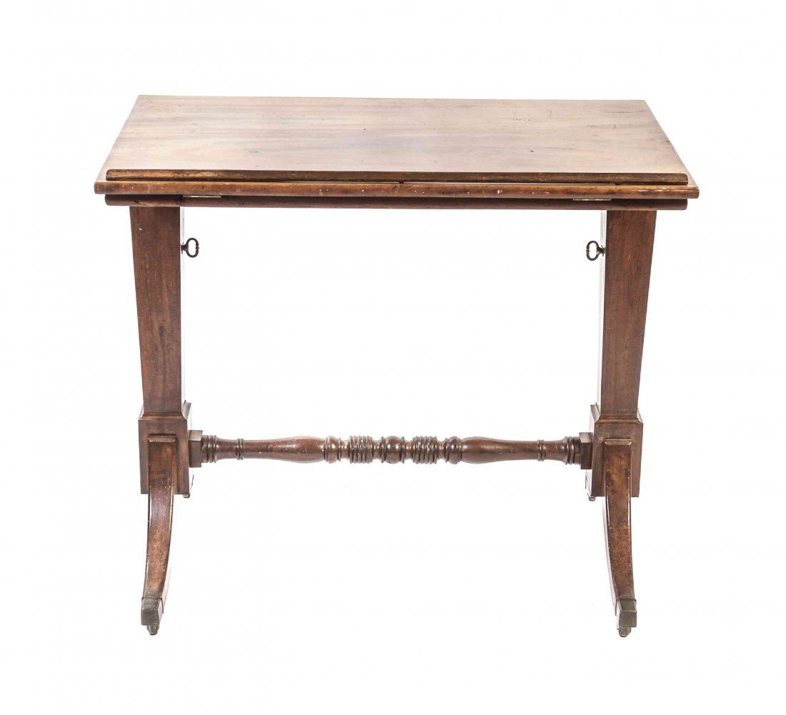 A Victorian Mahogany Drafting Table, Height 31 x width: A Victorian Mahogany Drafting Table, having a rectangular adjustable top raised on twin supports joined by a turned stretcher, further raised on downswept legs ending in casters. Height 31 x width 35