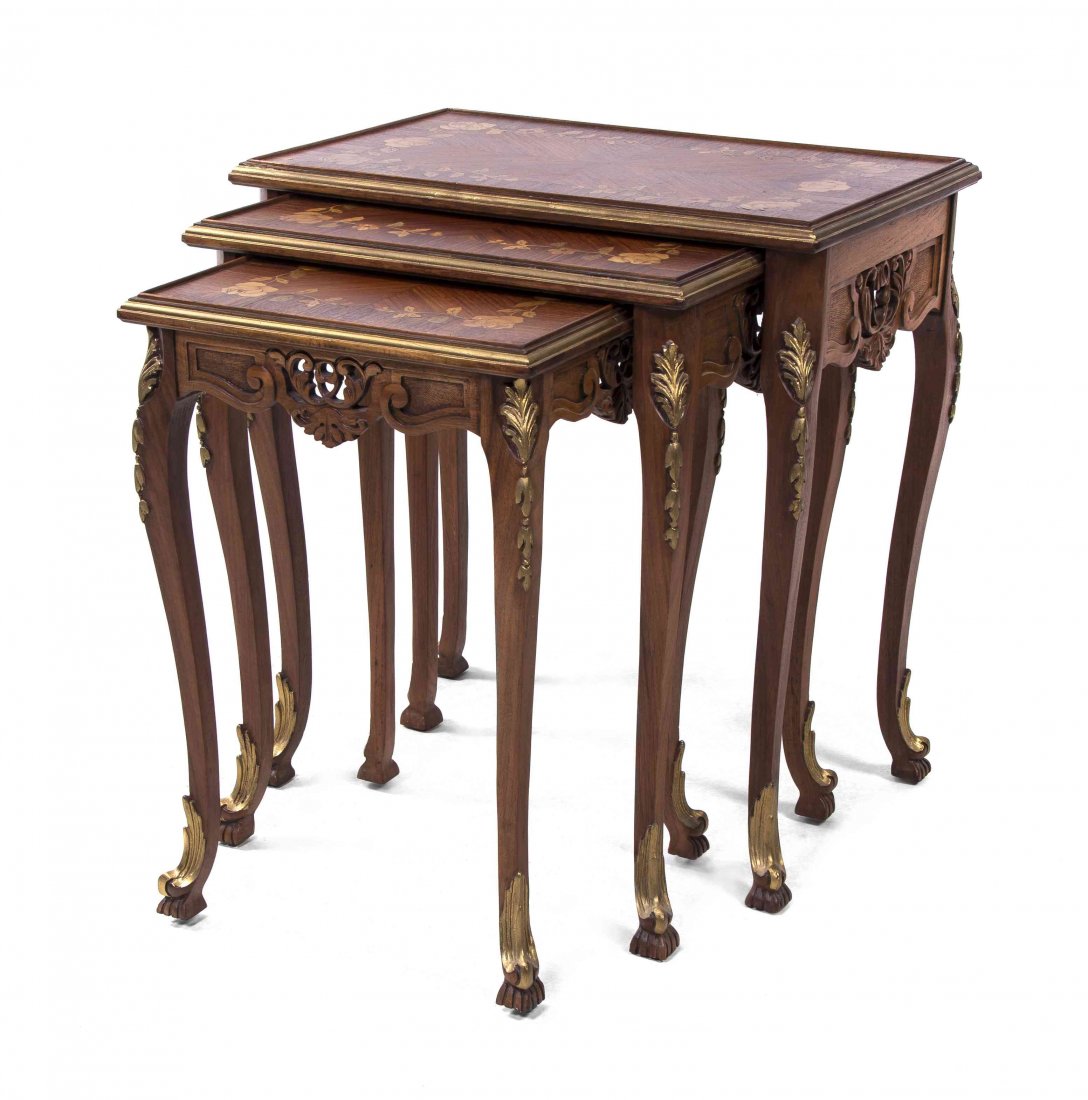 Three Continental Marquetry Decorated and Parcel Gilt: Three Continental Marquetry Decorated and Parcel Gilt Nesting Tables, each rectangular top with floral decoration, raised on carved cabriole legs. Height of tallest 24 1/2 x width 23 x depth 15 inches