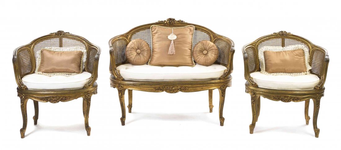 A Louis XV Style Giltwood Parlor Suite, Height of first: A Louis XV Style Giltwood Parlor Suite, comprising a settee and two bergeres, each having a caned back and seat with an upholstered cushion, raised on cabriole legs. Height of first 35 3/4 inches. Pro