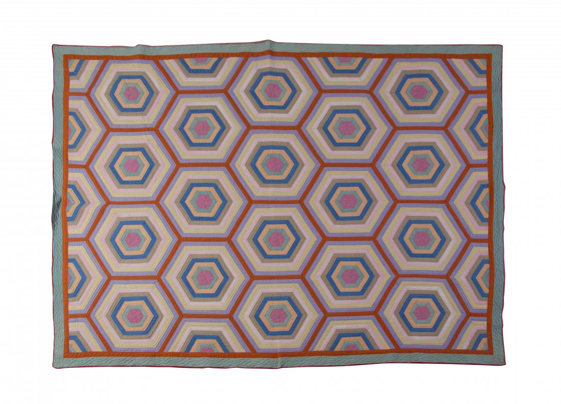 An American Op Quilt, 90 3/4 x 72 3/4 inches.: An American Op Quilt, 20th century, worked throughout with repeating hexagonal forms in various colors. 90 3/4 x 72 3/4 inches. Provenance: Acquired from the Private Collection of Sandra Mitchells (Mi