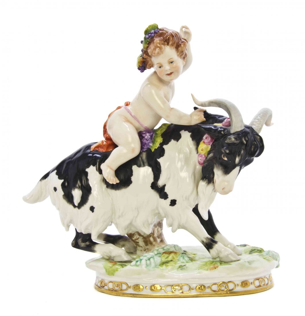 A Sitzendorf Porcelain Figural Group, Height 9 inches.: A Sitzendorf Porcelain Figural Group, depicting a Bacchic putto riding a goat, with crossed S mark in underglaze blue. Height 9 inches. Property from the Collection of a Lady, Oak Brook, Illinois