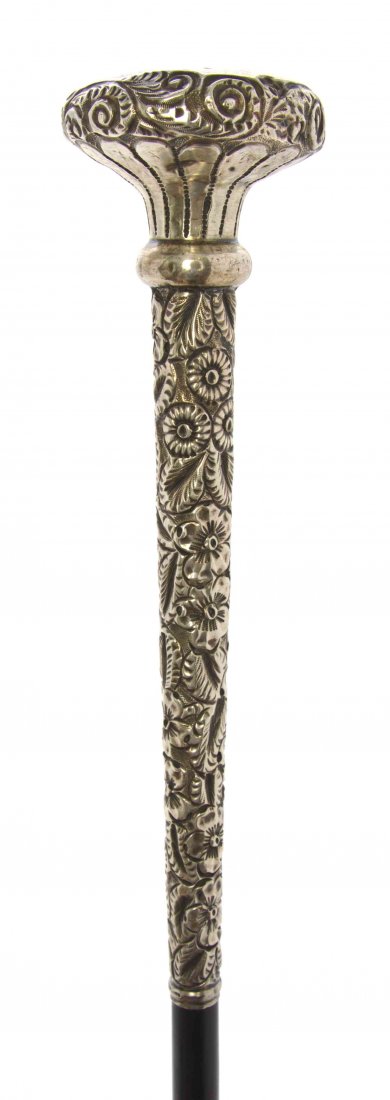 An American Silver Presentation Walking Stick, Length: An American Silver Presentation Walking Stick, late 19th century, having an ebony shaft ending in a German silver ferrule. Length of handle 1 7/8 x length overall 35 1/4 inches. Property from the R&M