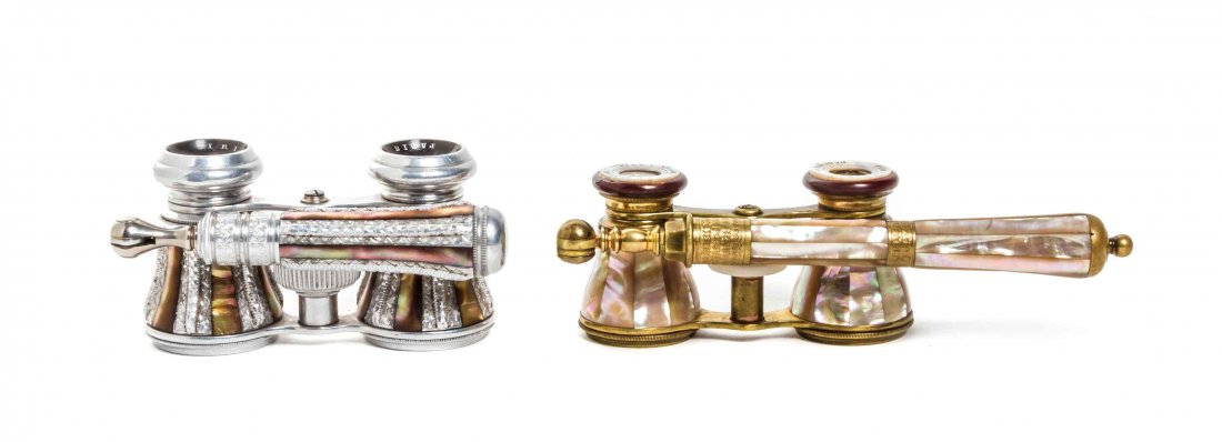 Two Pairs of French Mother-of-Pearl Veneered Opera: Two Pairs of French Mother-of-Pearl Veneered Opera Glasses, comprising an example by Iris with a steel frame and a pair retailed by Ferd. A. Nesler, Dubuque, Iowa with a brass frame, each having an ad