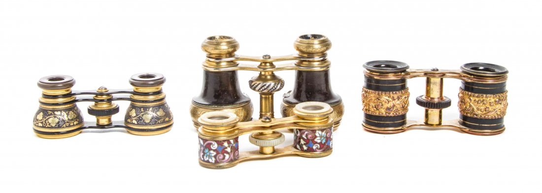 Four Pairs of French Opera Glasses, Width of widest 4: Four Pairs of French Opera Glasses, comprising two enameled, a repousse and a leather clad example. Width of widest 4 1/4 inches. Provenance: Property from the Estate of Mark Fritz, West Bloomfield, M