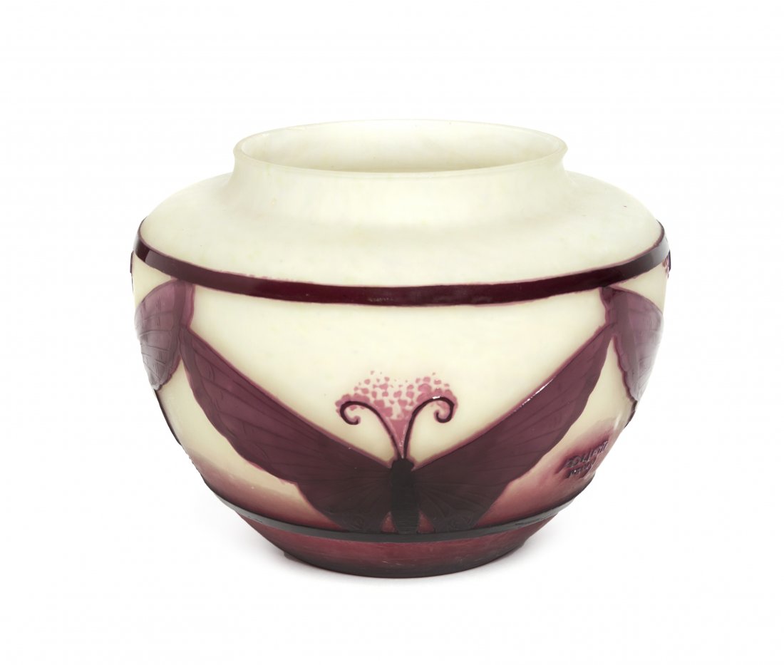 An Andre Delatte Cameo Glass Vase, (French, 1887-1953),: An Andre Delatte Cameo Glass Vase, (French, 1887-1953), of squat ovoid form, decorated with a band of four butterflies, signed A. Delatte, Nancy, in cameo. Height 5 3/8 inches. Property from the Adrie