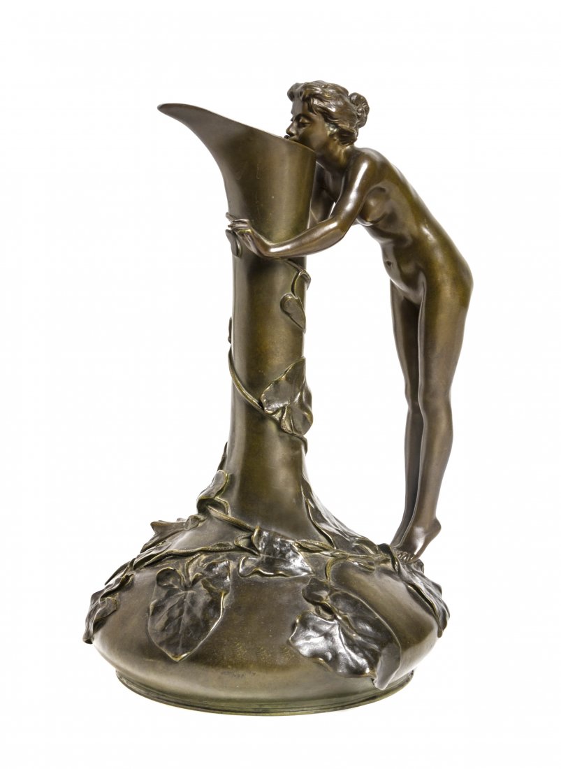 A French Art Nouveau Bronze Ewer, Jeanne Jozon: A French Art Nouveau Bronze Ewer, Jeanne Jozon (1868-1946), modeled with a nude female form handle, the body of the vessel applied with vines, signed J. Jozon, Salon 1898, with LV foundry mark. Height