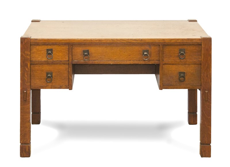 An Arts and Crafts Oak Desk, Height 30 x width 47 3/4 x: An Arts and Crafts Oak Desk, having a rectangular top over a series of five drawers, raised on square legs. Height 30 x width 47 3/4 x depth 30 inches. Property from the Estate of James M. Walsh, Chic