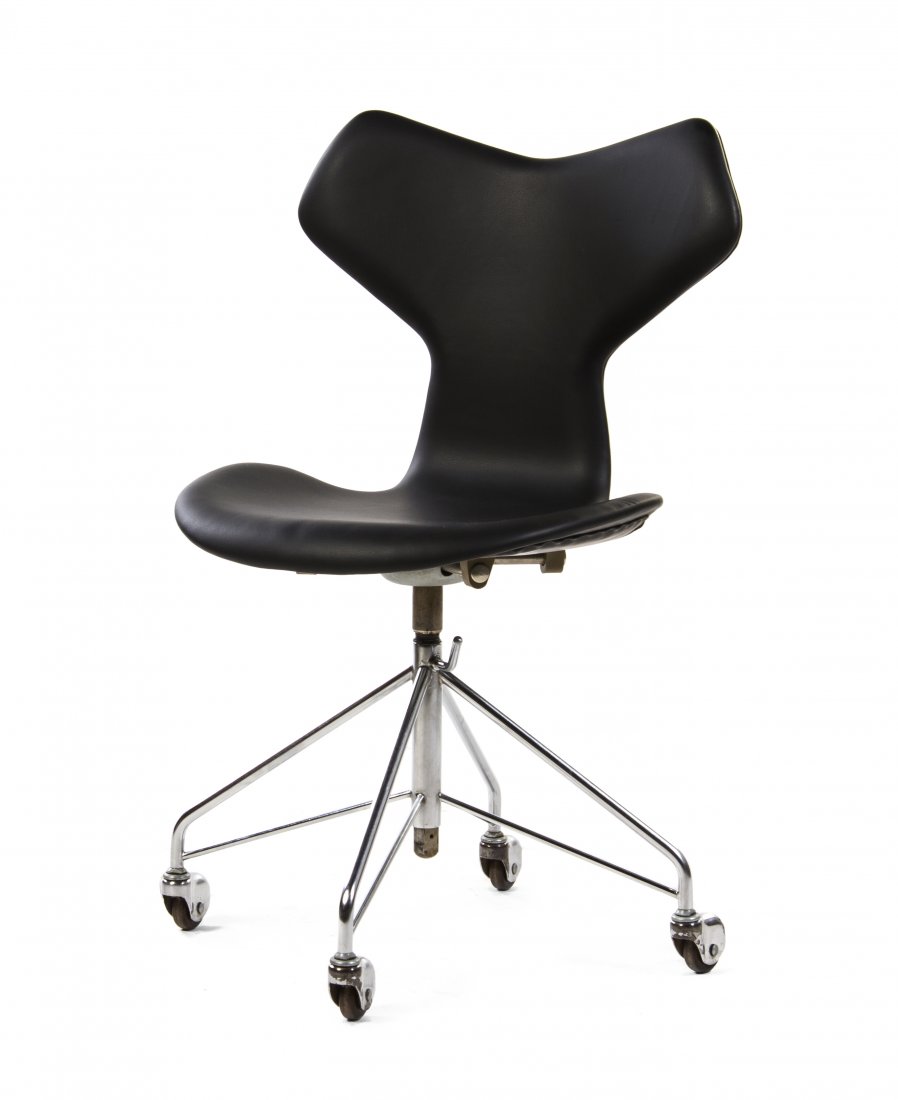 An Arne Jacobsen Chromed Steel Chair (Danish,: An Arne Jacobsen Chromed Steel Chair (Danish, 1902-1971), having an upholstered back and seat, raised on four tubular supports, ending in casters, marked Made in Denmark, 0964 by Fritz Hansen. Height 