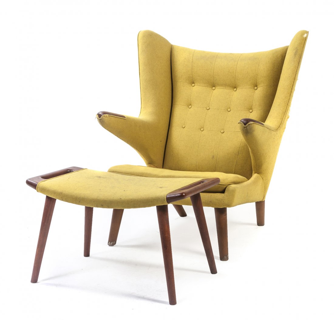 A Hans Wegner Teak Papa Bear Chair and Ottoman, (Danish: A Hans Wegner Teak Papa Bear Chair and Ottoman, (Danish, 1914-2007), having an upholstered tufted back, arms and seat, with exposed hand rests, raised on tapering cylindrical legs, marked Cabinetmaker