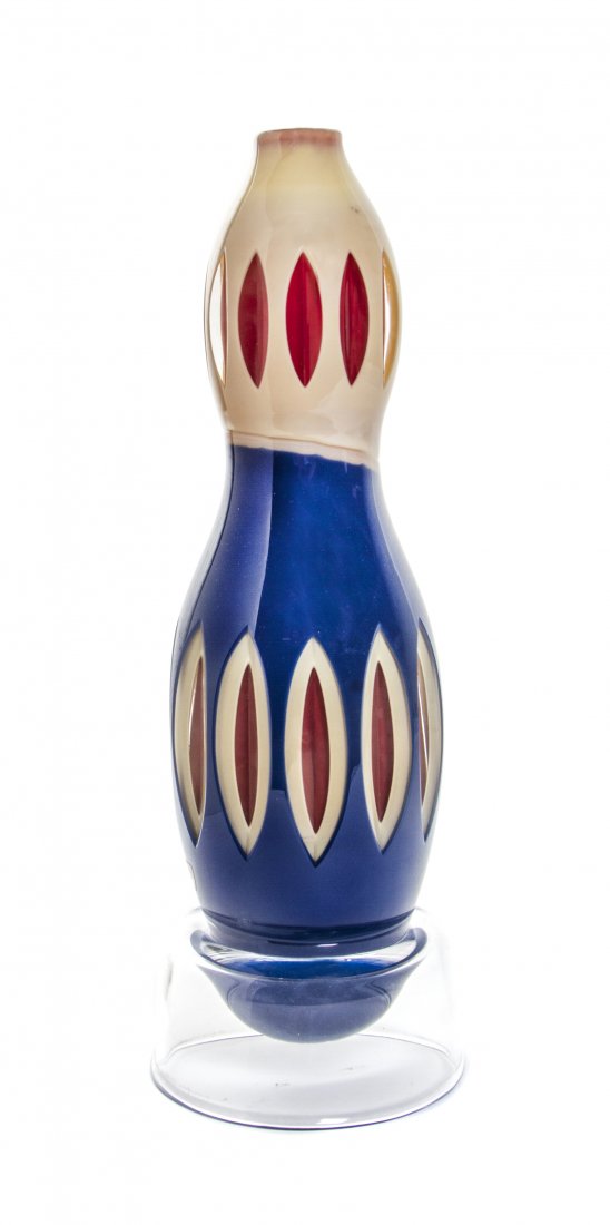 An Orrefors Cased Studio Glass Vase, Matz Borgstrom,: An Orrefors Cased Studio Glass Vase, Matz Borgstrom, of baluster form, cut to blue to tan to red with geometric decoration throughout, raised on a circular foot, signed Orrefors Gallery and numbered 9