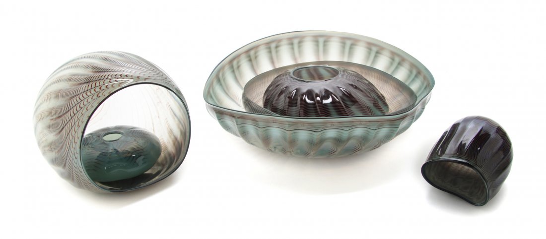 A Six-Piece American Studio Glass Sculpture, Dale: A Six-Piece American Studio Glass Sculpture, Dale Chihuly (b. 1941), 1981, Seaform, each with a green to brown mottled ground, four signed and dated. Width of largest 13 1/4 inches.