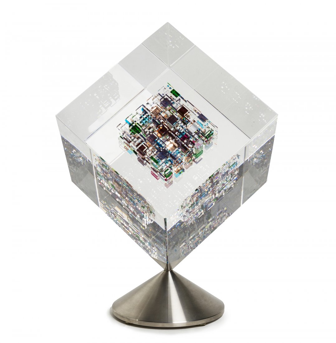 An American Studio Glass Sculpture, Jon Kuhn (b. 1949),: An American Studio Glass Sculpture, Jon Kuhn (b. 1949), Star Flower, of cube form with internal decoration, raised on a rotating steel base, signed, titled and dated 2001. Height 9 inches. Property fr