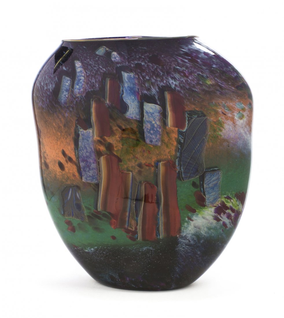 An American Studio Blown Glass Vessel, William Morris: An American Studio Blown Glass Vessel, William Morris (b.1957), from the Stonehenge series, 1984, of tapering form with a mottled background, signed and dated. Height 17 x width 15 x depth 5 inches.