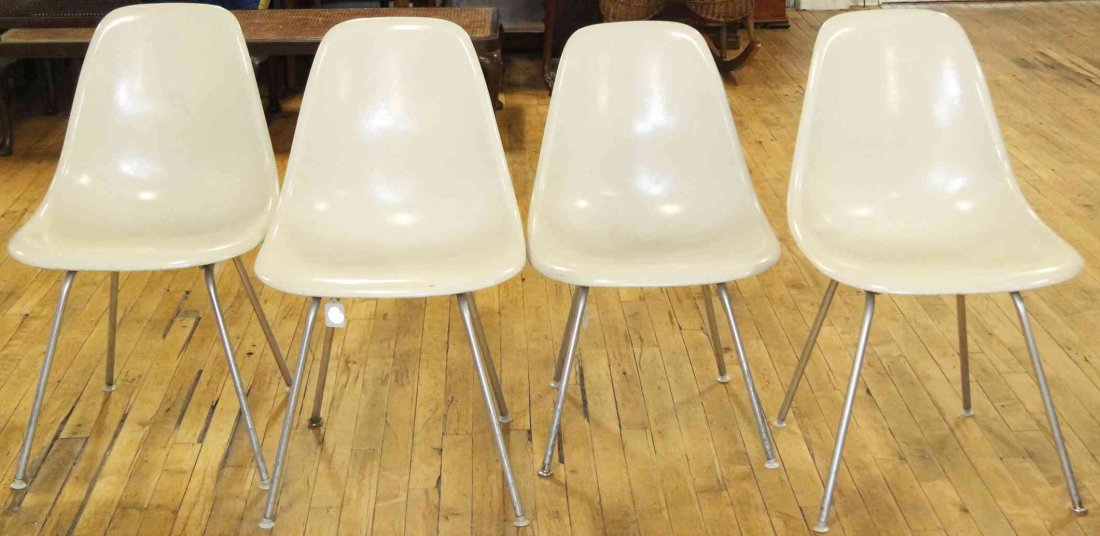 A Group of Four Charles and Ray Eames Chairs, Height 31: A Group of Four Charles and Ray Eames Chairs, white and raised on tubular legs. Height 31 inches. Property from the Collection of the Milwaukee Public Library, Milwaukee Wisconsin