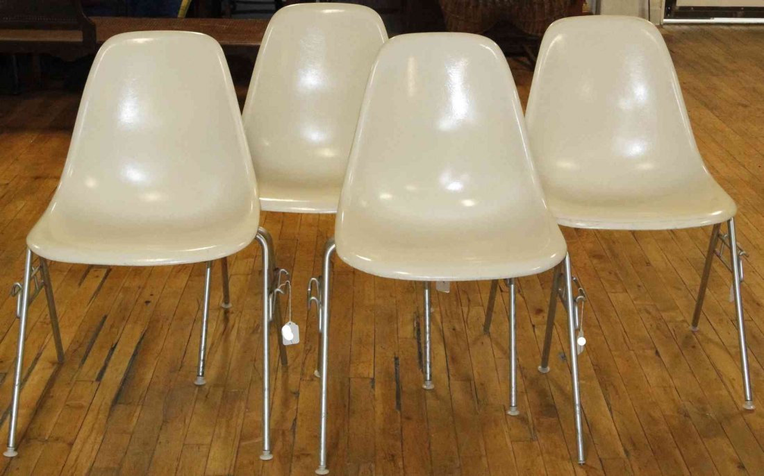 A Group of Four Charles and Ray Eames Chairs, Height 31: A Group of Four Charles and Ray Eames Chairs, white and raised on tubular legs. Height 31 inches. Property from the Collection of the Milwaukee Public Library, Milwaukee Wisconsin