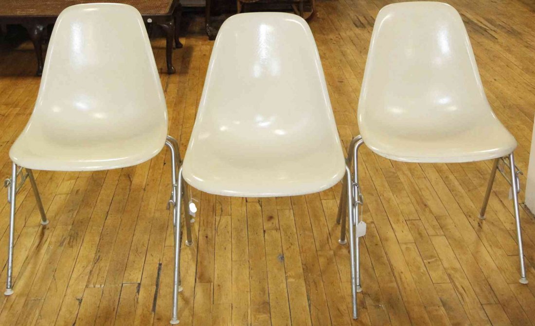 A Group of Six Charles and Ray Eames Chairs, Height 31: A Group of Six Charles and Ray Eames Chairs, white and raised on tubular legs. Height 31 inches. Property from the Collection of the Milwaukee Public Library, Milwaukee Wisconsin