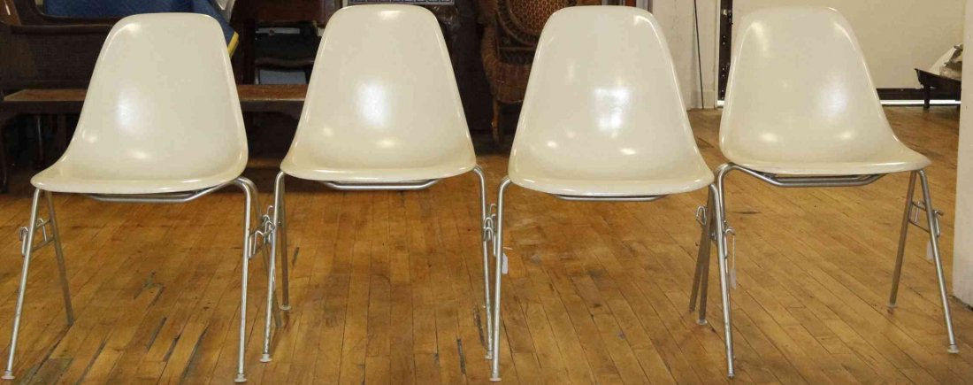 A Group of Eight Charles and Ray Eames Chairs, Height: A Group of Eight Charles and Ray Eames Chairs, white and raised on tubular legs. Height 31 inches. Property from the Collection of the Milwaukee Public Library, Milwaukee Wisconsin