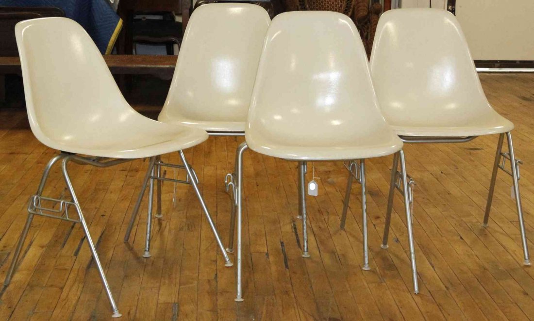 A Group of Seven Charles and Ray Eames Chairs, Height: A Group of Seven Charles and Ray Eames Chairs, white and raised on tubular legs. Height 31 inches. Property from the Collection of the Milwaukee Public Library, Milwaukee Wisconsin
