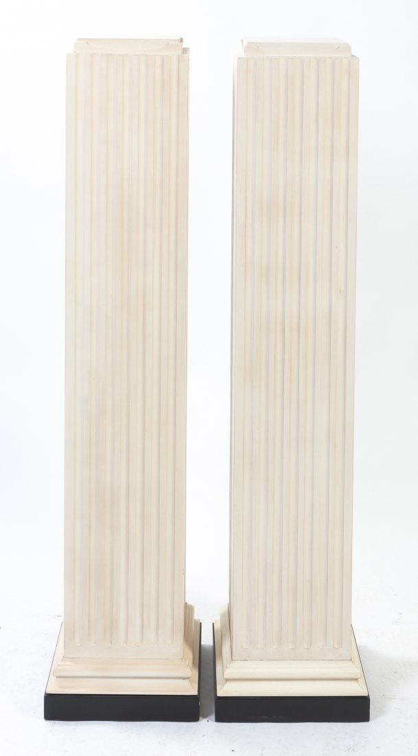 A Pair of Faux Wood Pedestals, Height 55 1/4 inches.: A Pair of Faux Wood Pedestals, each of rectangular ribbed form, raised on a stepped square base. Height 55 1/4 inches. Property from the Collection of John Robert Wiltgen, Chicago, Illinois