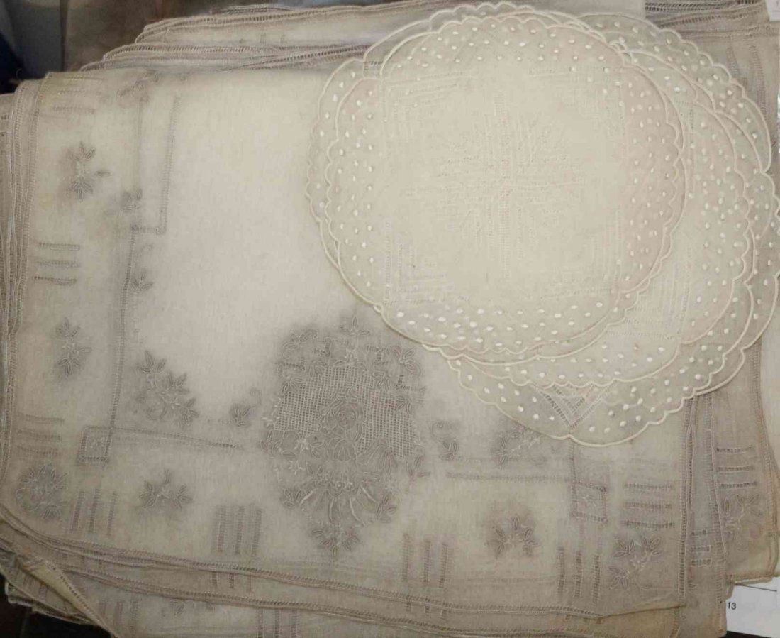 A Collection of French Embroidered Linens, Length of: A Collection of French Embroidered Linens, comprising 8 placemats, 8 napkins, a runner and 9 coasters; 25 items total. Length of first 16 x width 11 inches.