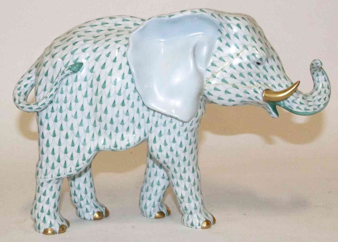 A Herend Porcelain Elephant, Height 10 inches.: A Herend Porcelain Elephant, with gilt highlights and fishnet decoration throughout. Height 10 inches. Property from the Estate of Louis M. and Linda M. Byron, Tucson, Arizona