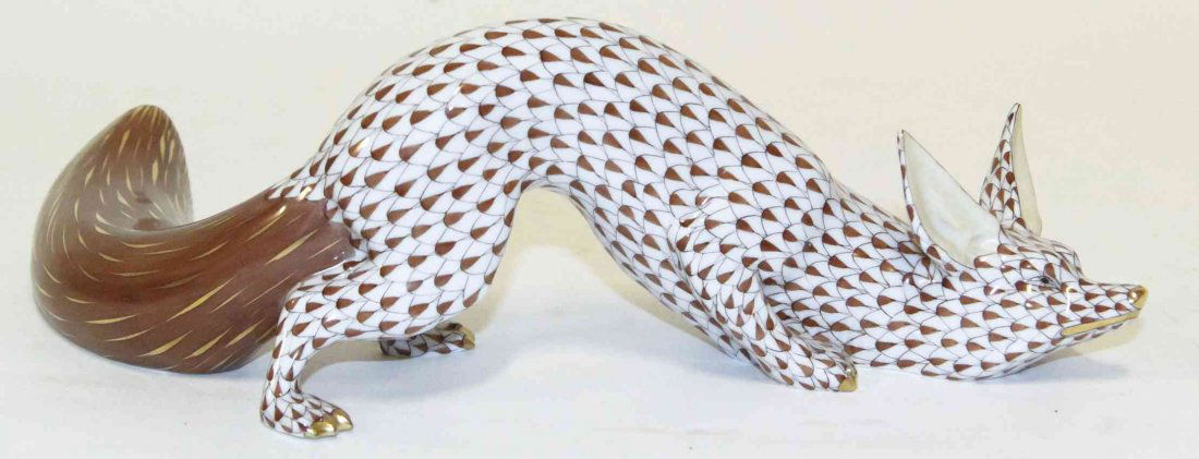 A Herend Porcelain Fox, Height 3 1/2 inches.: A Herend Porcelain Fox, with gilt highlights and fishnet decoration throughout. Height 3 1/2 inches. Property from the Estate of Louis M. and Linda M. Byron, Tucson, Arizona