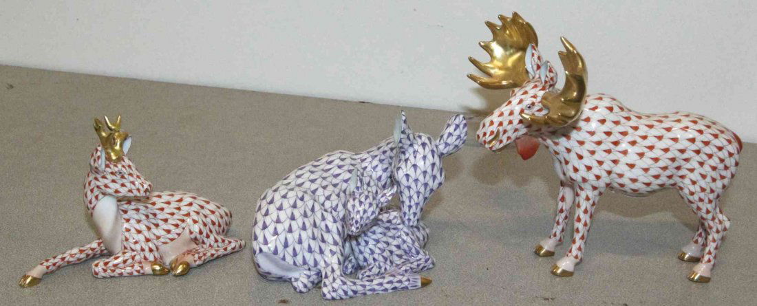 Three Herend Porcelain Figures, Height of largest 5 1/2: Three Herend Porcelain Figures, comprising a moose, an elk and a deer with nestled fawn, with gilt highlights and fishnet decoration throughout. Height of largest 5 1/2 inches. Property from the Estat