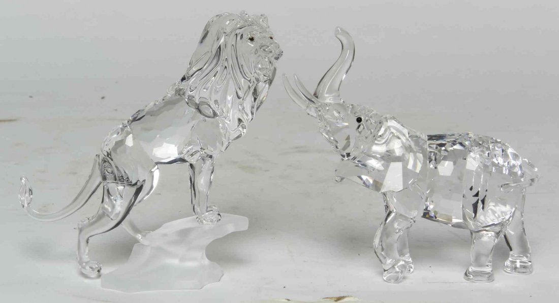 Two Swarovski Cut Glass Figures, Height of tallest 4: Two Swarovski Cut Glass Figures, comprising an elephant and a lion. Height of tallest 4 3/4 inches. Property from the Estate of Louis M. and Linda M. Byron, Tucson, Arizona