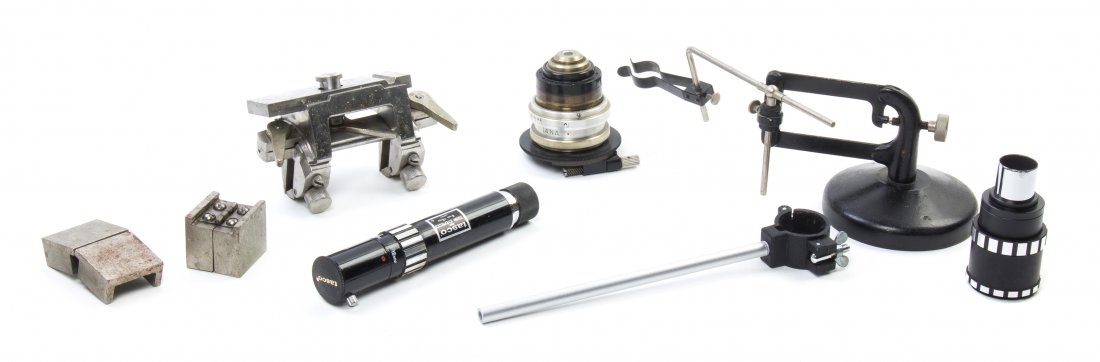 A Collection of Microscope Lenses and Related: A Collection of Microscope Lenses and Related Accessories, each of various size and vintage and an American Spencer cast iron and steel lens grinder; approximately 115 items total. Height of tallest c