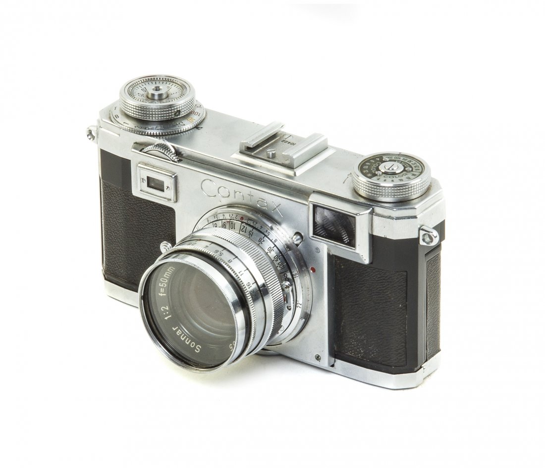 A Contax 35mm IIa Camera, Width 5 1/4 inches.: A Contax 35mm IIa Camera, circa 1955, serial number F20422, with Ziess Sonner 1:2 lens, leather case and strap. Width 5 1/4 inches. Property from the Collection of Mr. and Mrs. John M. Hollingsworth, 