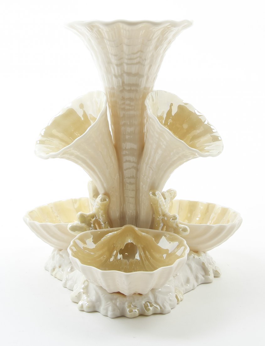 A Belleek Epergne, Height 7 1/8 inches.: A Belleek Epergne, 1963-present, having four bud vases and three shell form bowls, all with lustrous interiors, with sixth Belleek green mark. Height 7 1/8 inches. Property from a Midwest Family Colle