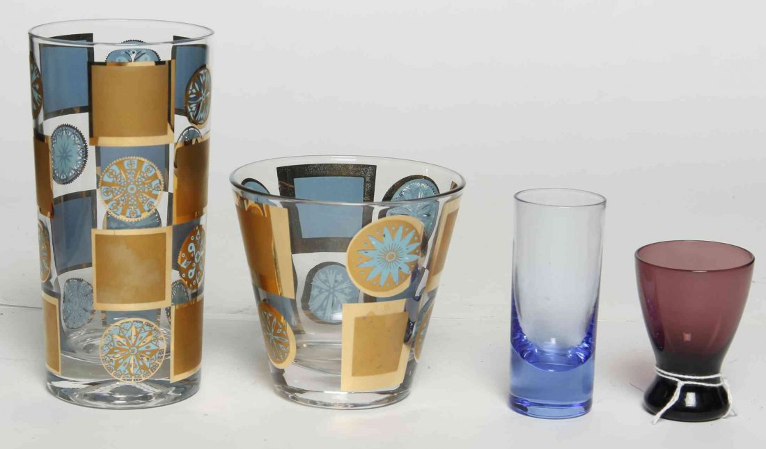 A Set of Blue and Gold Glasses, Height of tallest 5 5/8: A Set of Blue and Gold Glasses, comprising 12 tumblers and 12 highballs, together with a group of 4 double jigger and 5 egg cups. Height of tallest 5 5/8 inches.