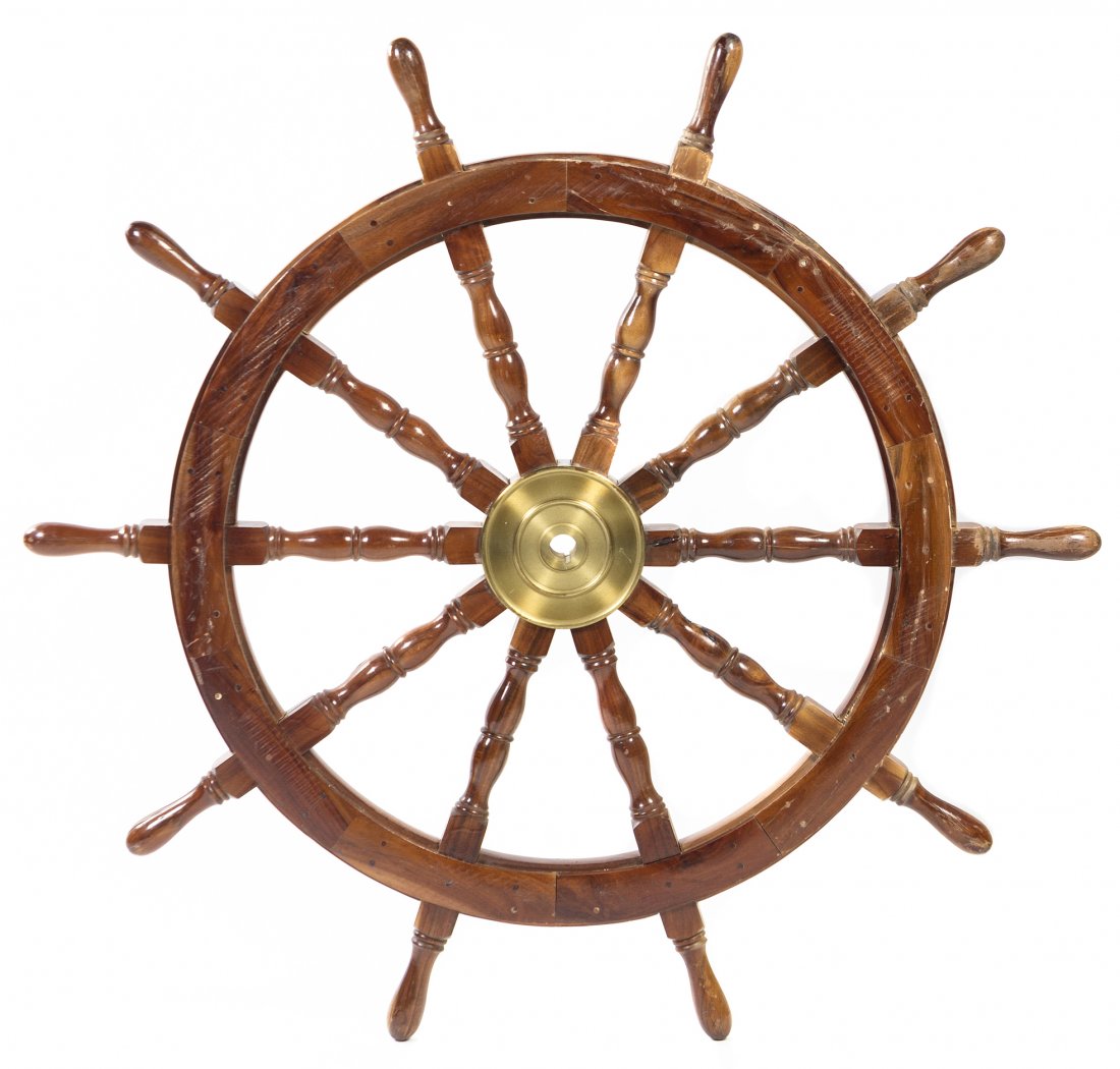 A Mahogany and Brass Ship Wheel, Diameter 45 inches.: A Mahogany and Brass Ship Wheel, having turned baluster spindles and handles. Diameter 45 inches.