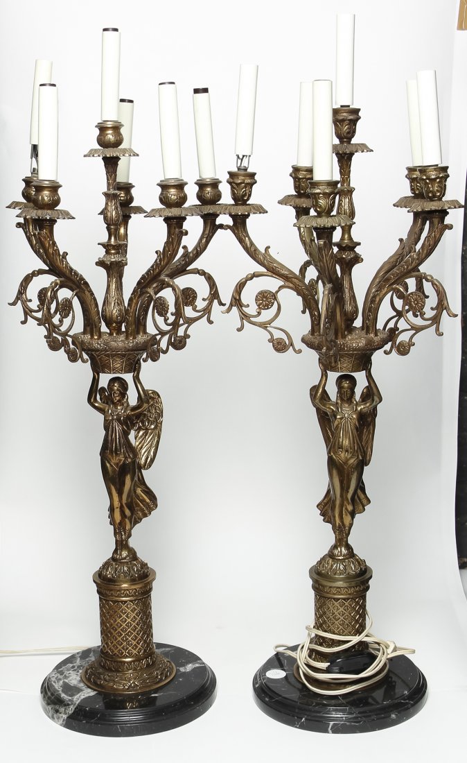 A Pair of Continental Figural Six-Light Gilt Metal: A Pair of Continental Figural Six-Light Gilt Metal Candelabra, each in the form of a winged maiden set on a marble base. Height 32 1/2 inches. Property from the Collection of Ann Gerber, Skokie, Illin
