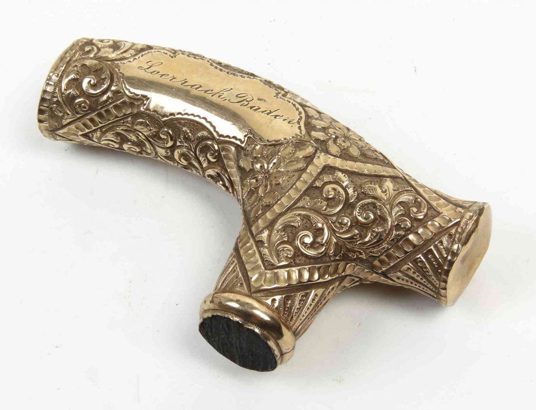 An American Gold Filled Cane Handle, Width 4 3/8: An American Gold Filled Cane Handle, having allover scrolling decoration, stamped B. Width 4 3/8 inches. Property from the Estate of Mr. and Mrs. David Weil, Chicago, Illinois