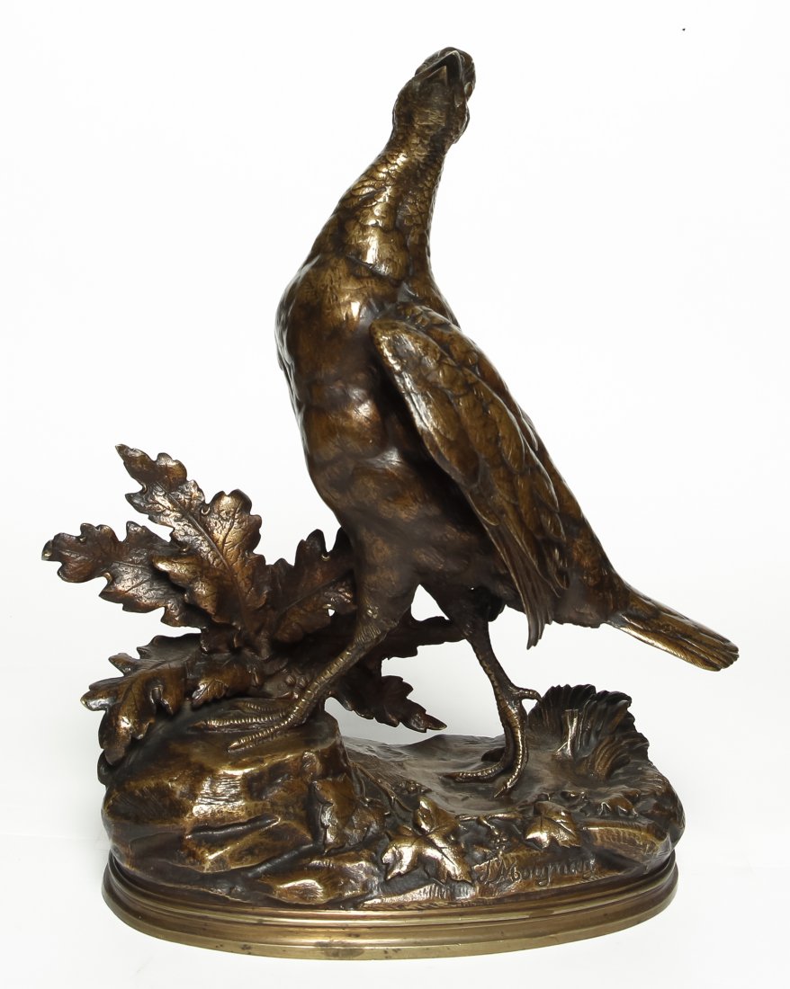A French Bronze Animalier Figure, after Jules Moigniez: A French Bronze Animalier Figure, after Jules Moigniez (1835-1894), depicting a partridge on a rocky base cast with vines and foliage, signed J. Moigniez. Height 12 1/2 inches.