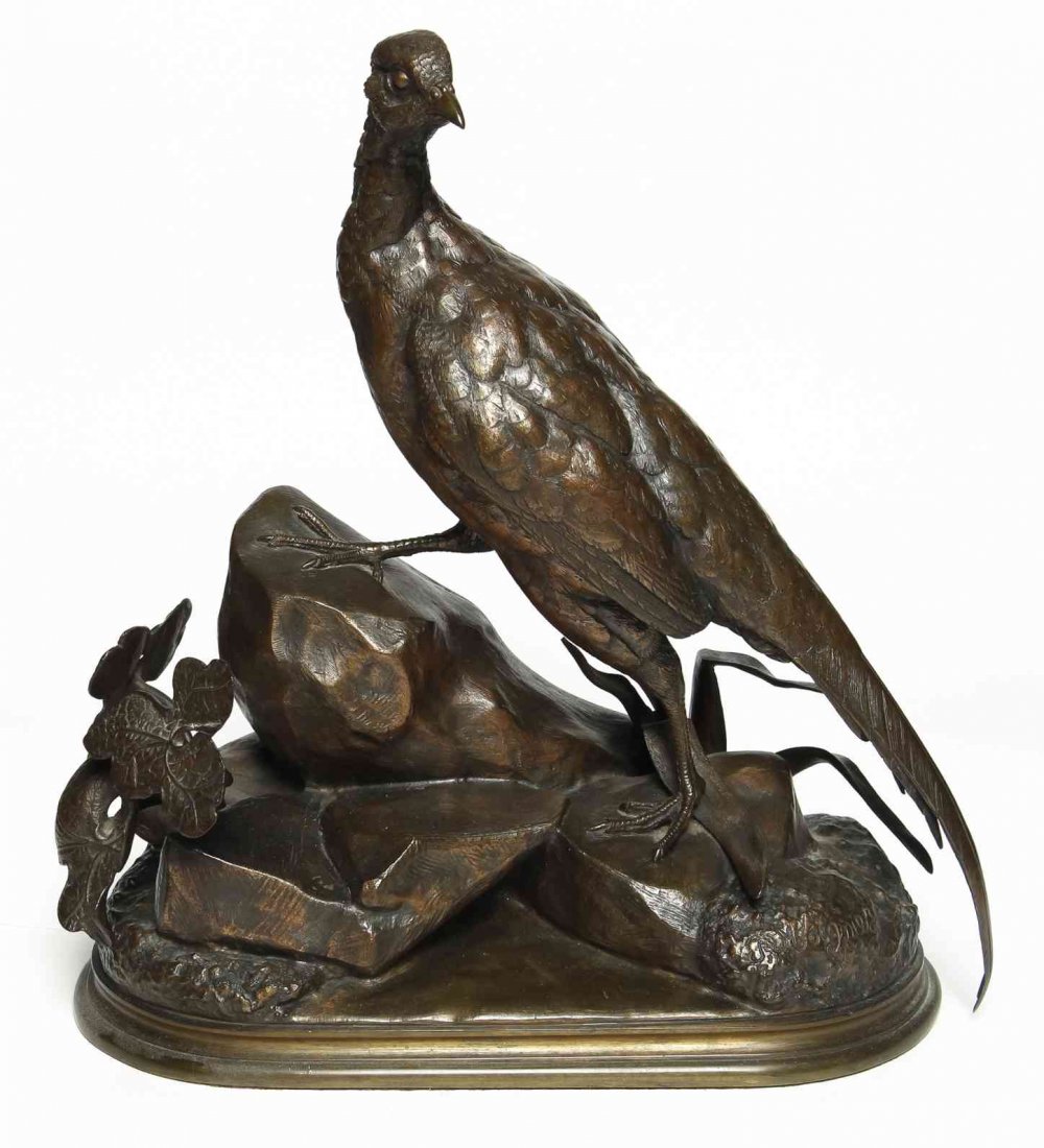 A French Bronze Ornithological Figure, after Jules: A French Bronze Ornithological Figure, after Jules Moigniez (1835-1894), depicting a partridge on a rocky outcropping, signed J. Moigniez. Height 13 inches.
