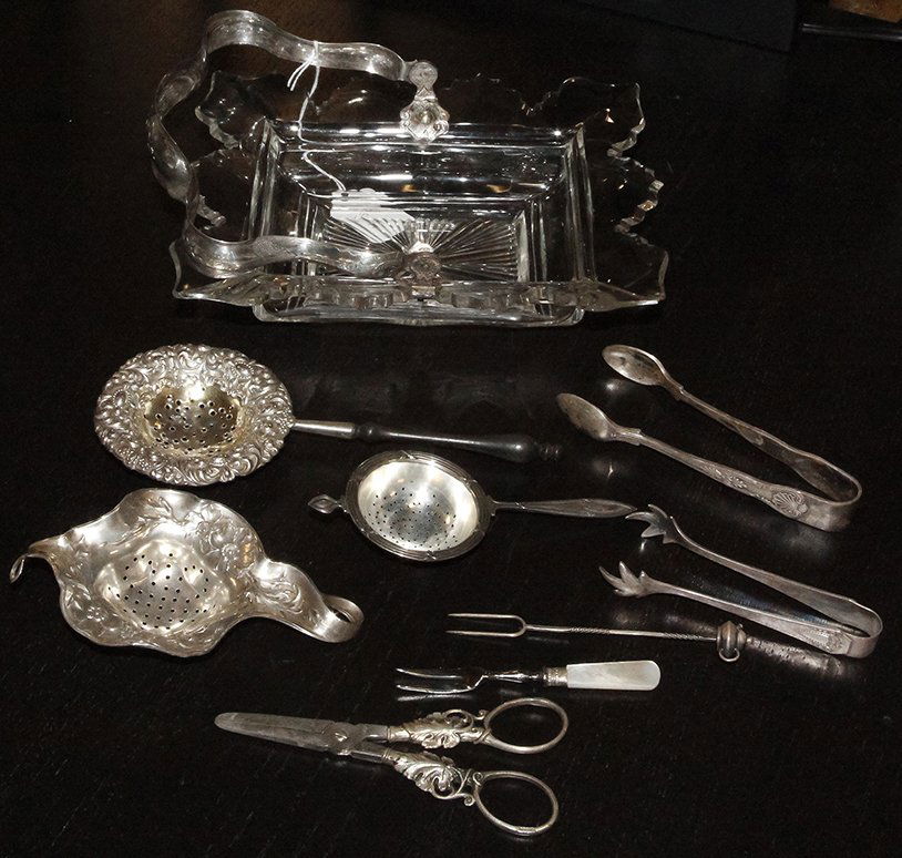 A Group of Silver Table Articles, Late 19th/20th: A Group of Silver Table Articles, Late 19th/20th Century, comprising a cut glass bowl with silver swing handle, three American silver tea strainers, a pair of German grape shears, and a lemon fork, to