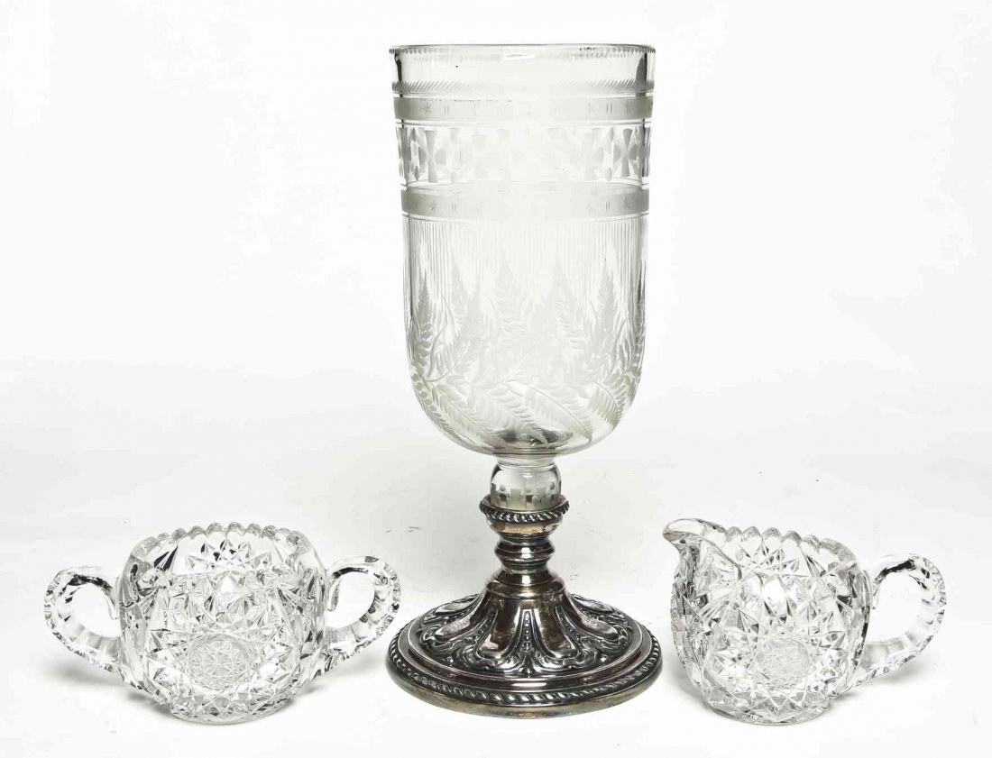 An English Silver-Plate and Etched Glass Candlestick,: An English Silver-Plate and Etched Glass Candlestick, together with a cut glass creamer and sugar. Height 11 inches. Property from the Collection of Ed and Dolores Herrmann, Kirksville, Missouri
