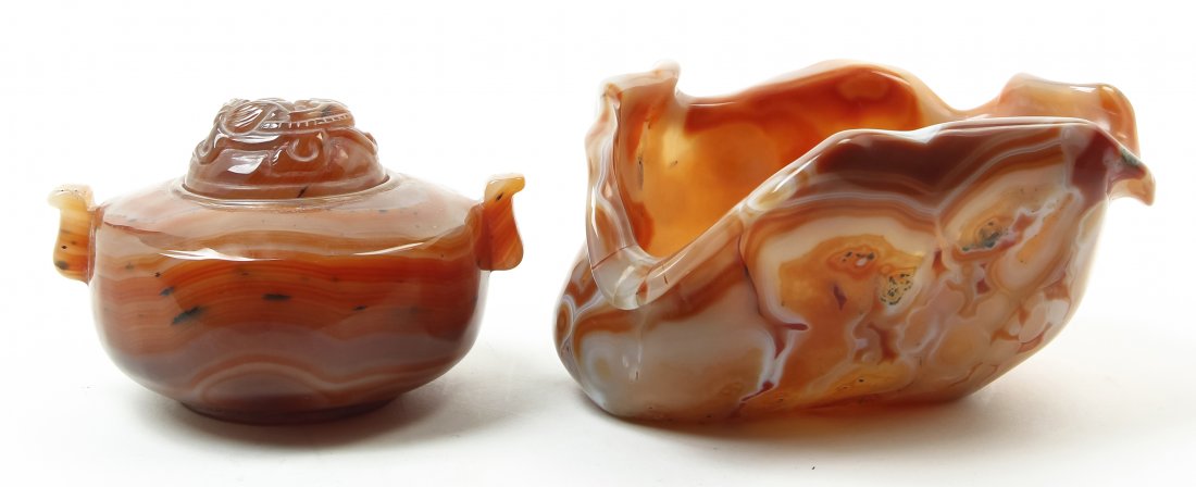 Two Chinese Carved Agate Articles, Width of wider 7: Two Chinese Carved Agate Articles, comprising a lidded censer of circular handled form and a brushwasher of organic form. Width of wider 7 inches. Property from the Collection of Marion P. Church, Chi