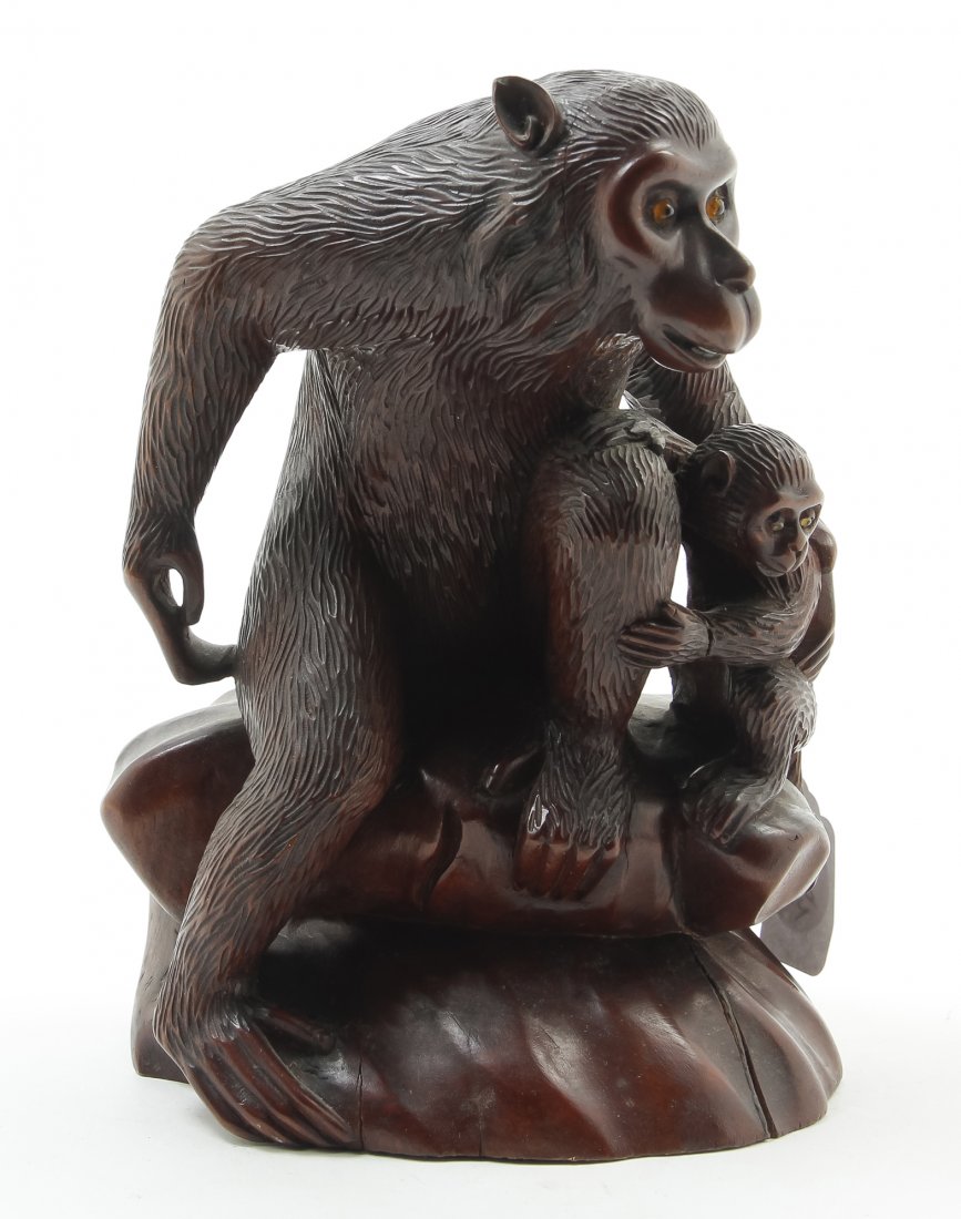 A Japanese Carved Wood Okimono, Height 8 1/4 inches.: A Japanese Carved Wood Okimono, depicting a mother monkey and her child, each with inlaid eyes, on a naturalistic base. Height 8 1/4 inches. Property from the Collection of Marion P. Church, Chicago, 