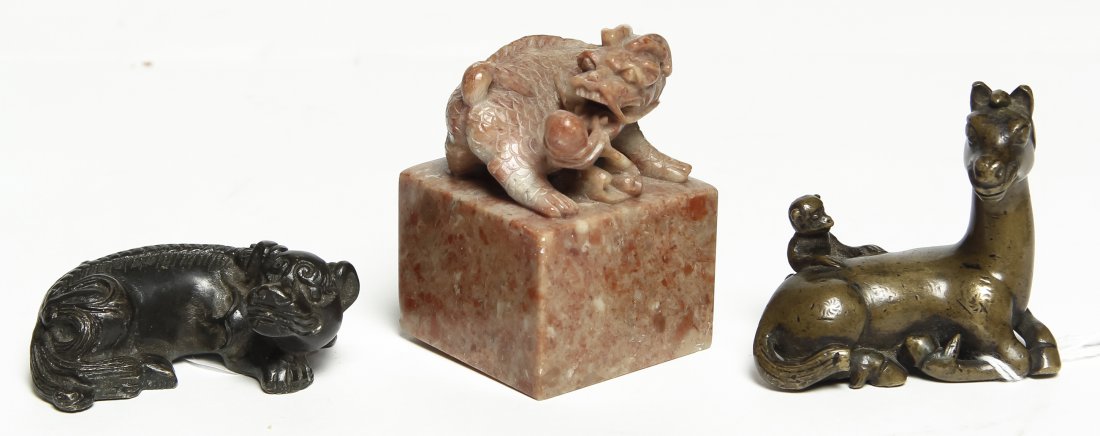 Three Chinese Articles, Height of tallest 2 3/8 inches.: Three Chinese Articles, comprising two bronze scroll weights and one steatite seal stamp. Height of tallest 2 3/8 inches. Property from the Estate of William A. Scott, Kansas City, Missouri