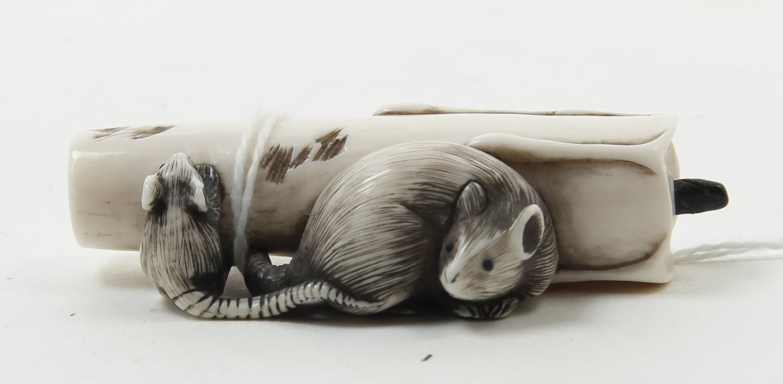 A Japanese Carved Ivory Netsuke, Width 2 1/4 inches.: A Japanese Carved Ivory Netsuke, depicting two rats with a candle, signed. Width 2 1/4 inches.