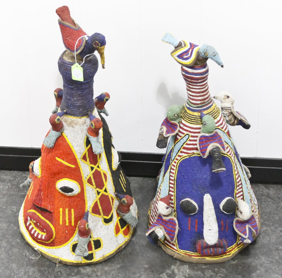 Two Yoruba Beaded Crowns, Height of taller 23 inches.: Two Yoruba Beaded Crowns, each with opposing masks and applied birds, having removable bird form finials. Height of taller 23 inches. Property from the Collection of Gerald F. Glaeve, Mount Horeb, Wis