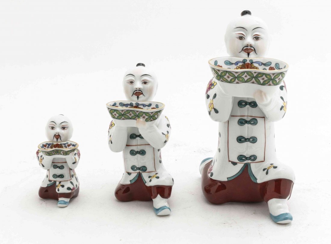 Three Herend Porcelain Figures, Height of tallest 6 1/4: Three Herend Porcelain Figures, each worked to show a Chinese servant, each of graduating size. Height of tallest 6 1/4 inches. Property from the Collection of Lisa Robbins, Milwaukee, Wisconsin