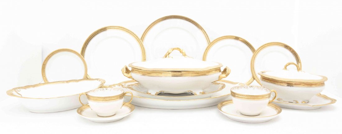A Limoges Porcelain Partial Dinner Service, Diameter of: A Limoges Porcelain Partial Dinner Service, having gilt geometric edging, comprising 12 dinner plates, 11 luncheon plates, 12 dessert plates, 12 bread plates, 12 bowls, 24 saucers, 11 broths, 9 cups, 
